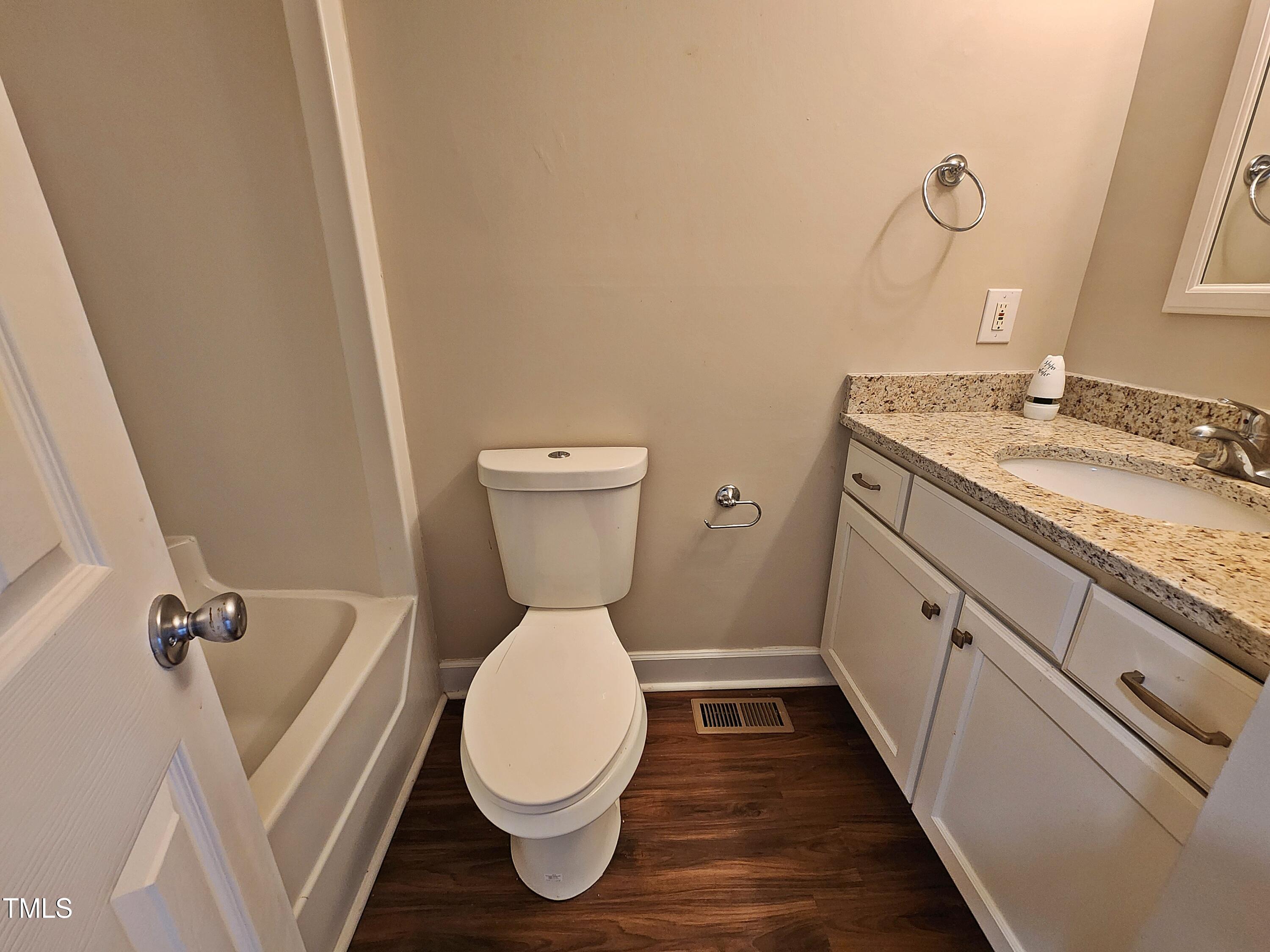 120 Keith Court Willow Spring, NC 27592 - Photo 23 of 25 a bathroom with a granite countertop toilet sink and mirror