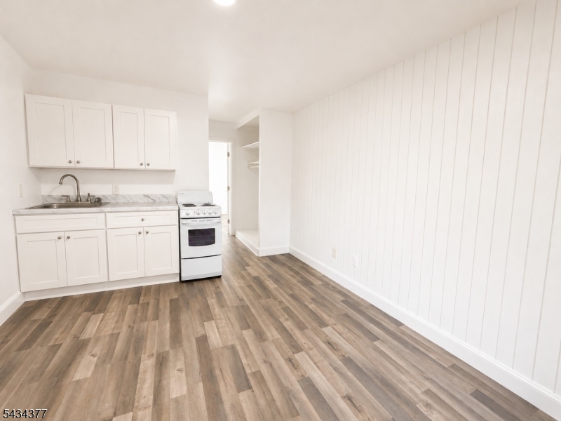 207 Old Chimney Ridge Road, Unit B Montague, NJ 07827 - Photo 2 of 10 a view of a kitchen with a sink and dishwasher with wooden floor