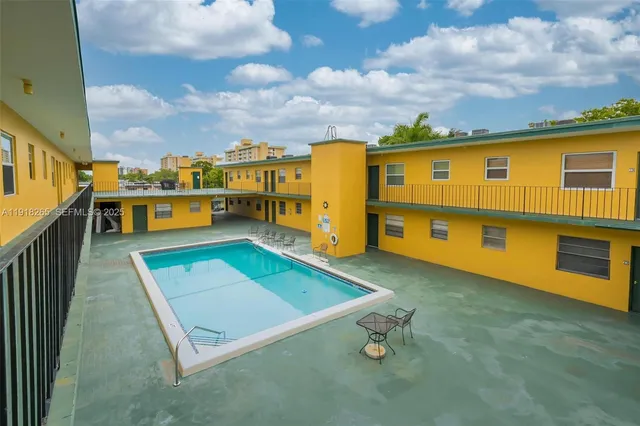 a view of an chairs in the backyard
