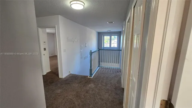 a view of a hallway with windows