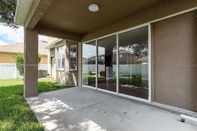 a view of a glass door with a balcony