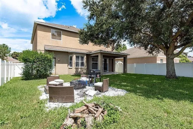 a front view of a house with a yard and porch