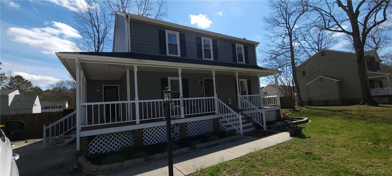 a view of house with backyard porch and furniture