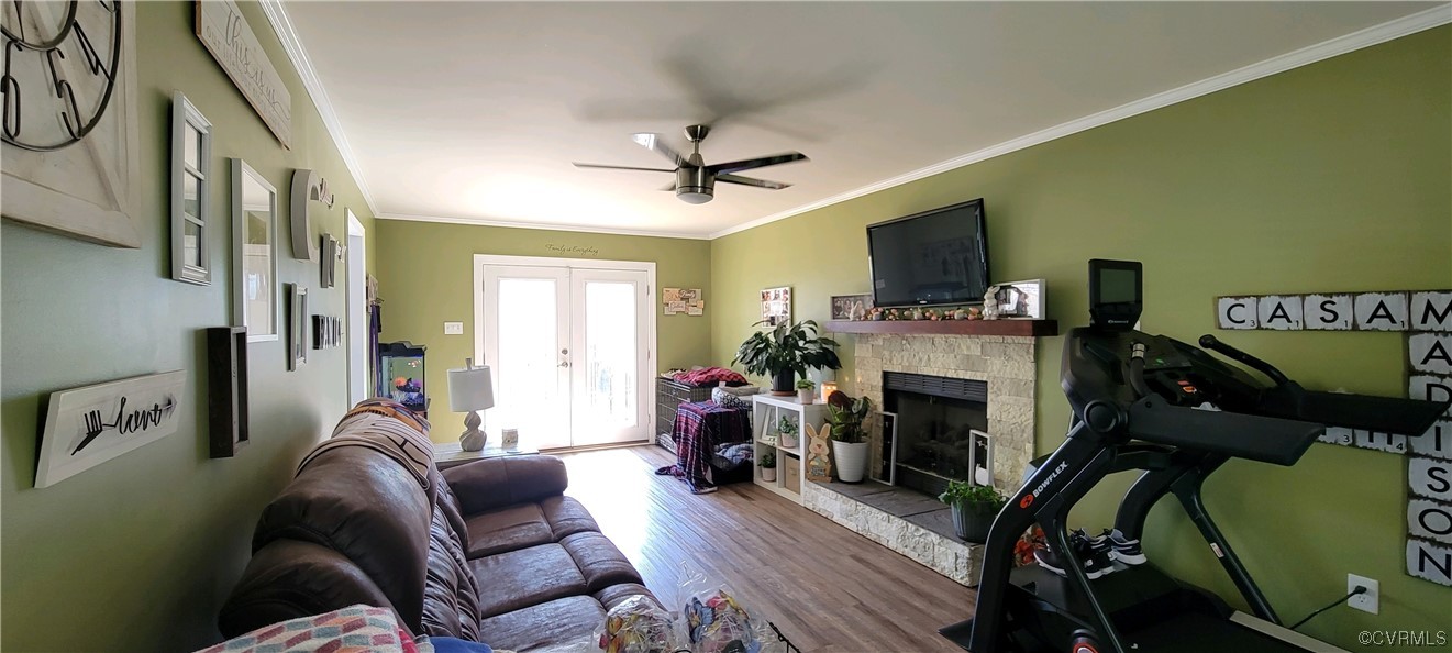 4924 Old Logging Circle Prince George, VA 23875 - Photo 14 of 22 a living room with furniture a flat screen tv and a fireplace