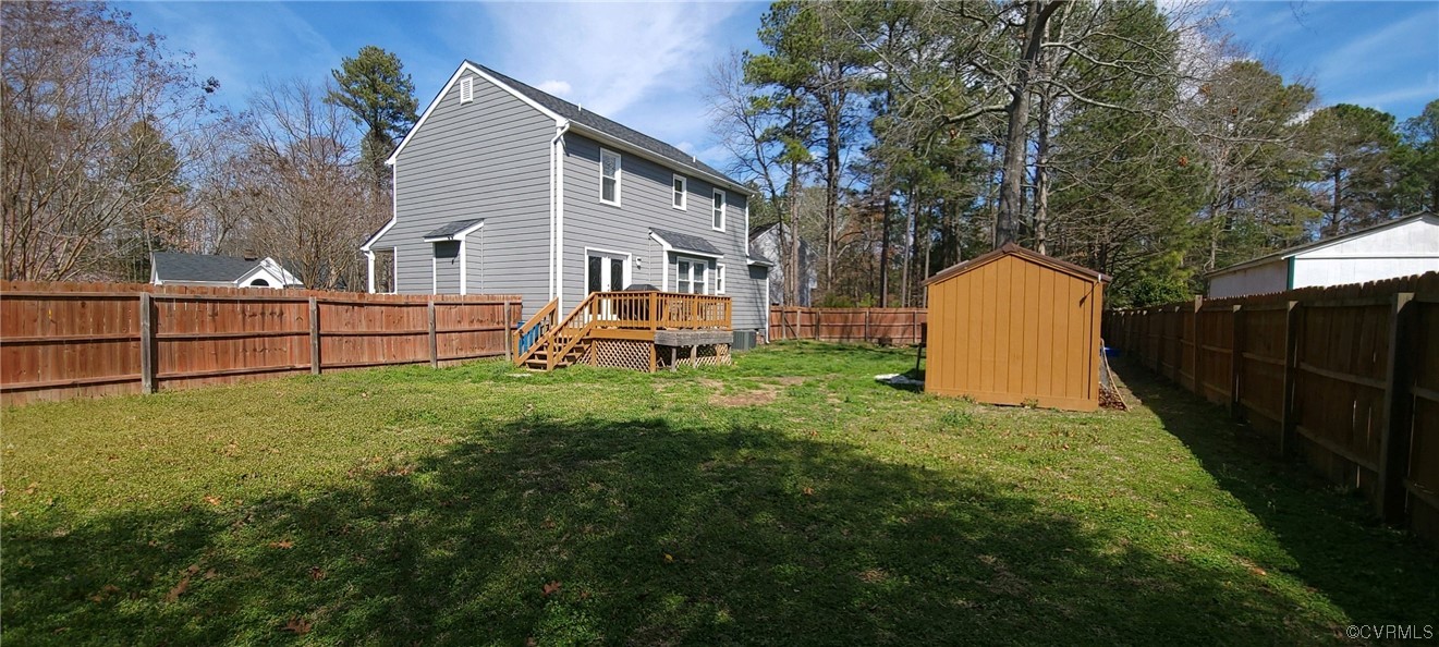 4924 Old Logging Circle Prince George, VA 23875 - Photo 4 of 22 a view of a backyard with a garden and wooden fence