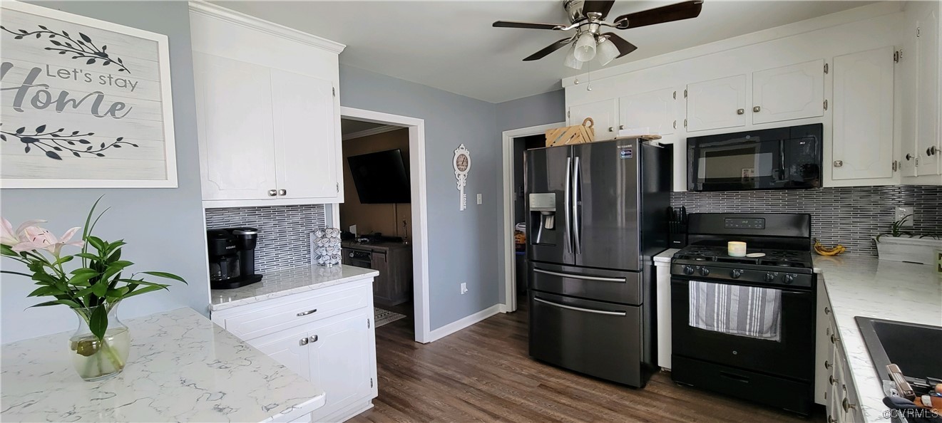 4924 Old Logging Circle Prince George, VA 23875 - Photo 8 of 22 a kitchen with granite countertop a refrigerator and a stove top oven