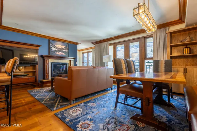 a living room with furniture a rug and a fireplace