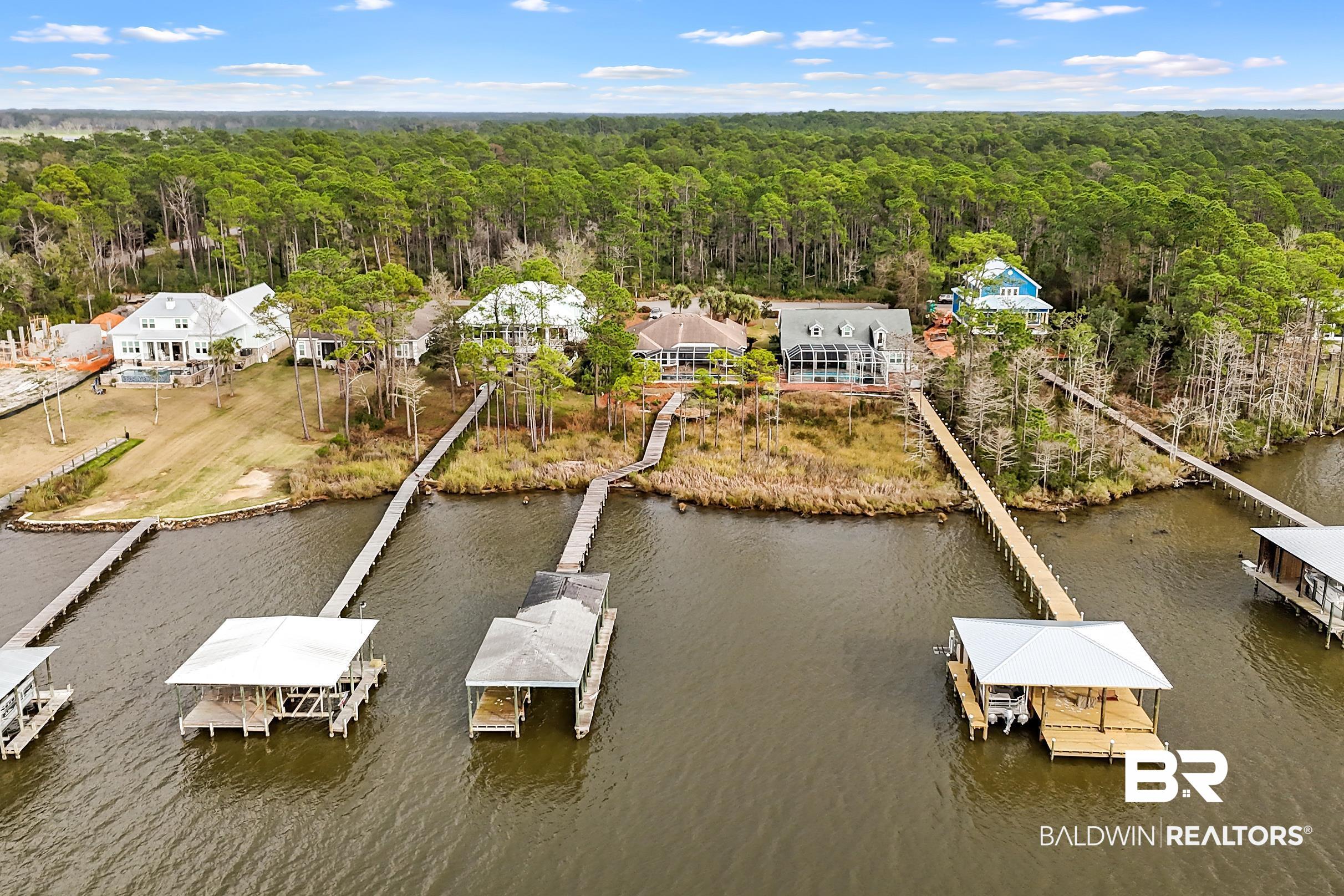 8591 Bay Harbor Road Elberta, AL 36530 - Photo 45 of 56 Bird's eye view of a nearby body of water and a heavily wooded area