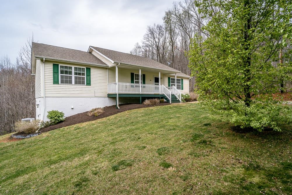 4350 Sharon Road Esmont, VA 22937 - Photo 23 of 40 a front view of a house with garden