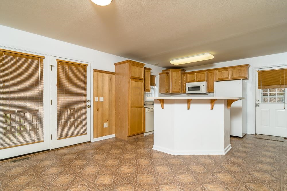 4350 Sharon Road Esmont, VA 22937 - Photo 3 of 40 a view of a kitchen with furniture and an empty room