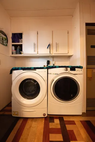 a bed room with a bed window and dresser