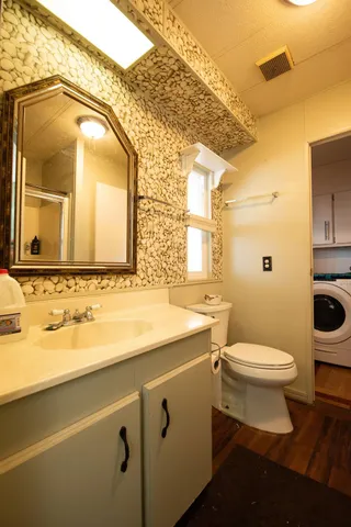a view of a room with wooden floor and closet
