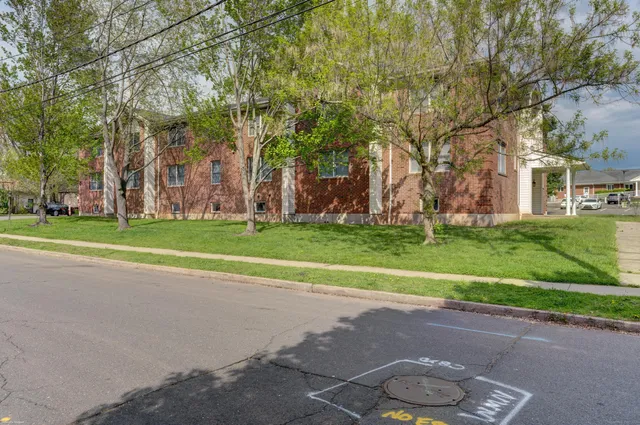 a building with trees in front of it