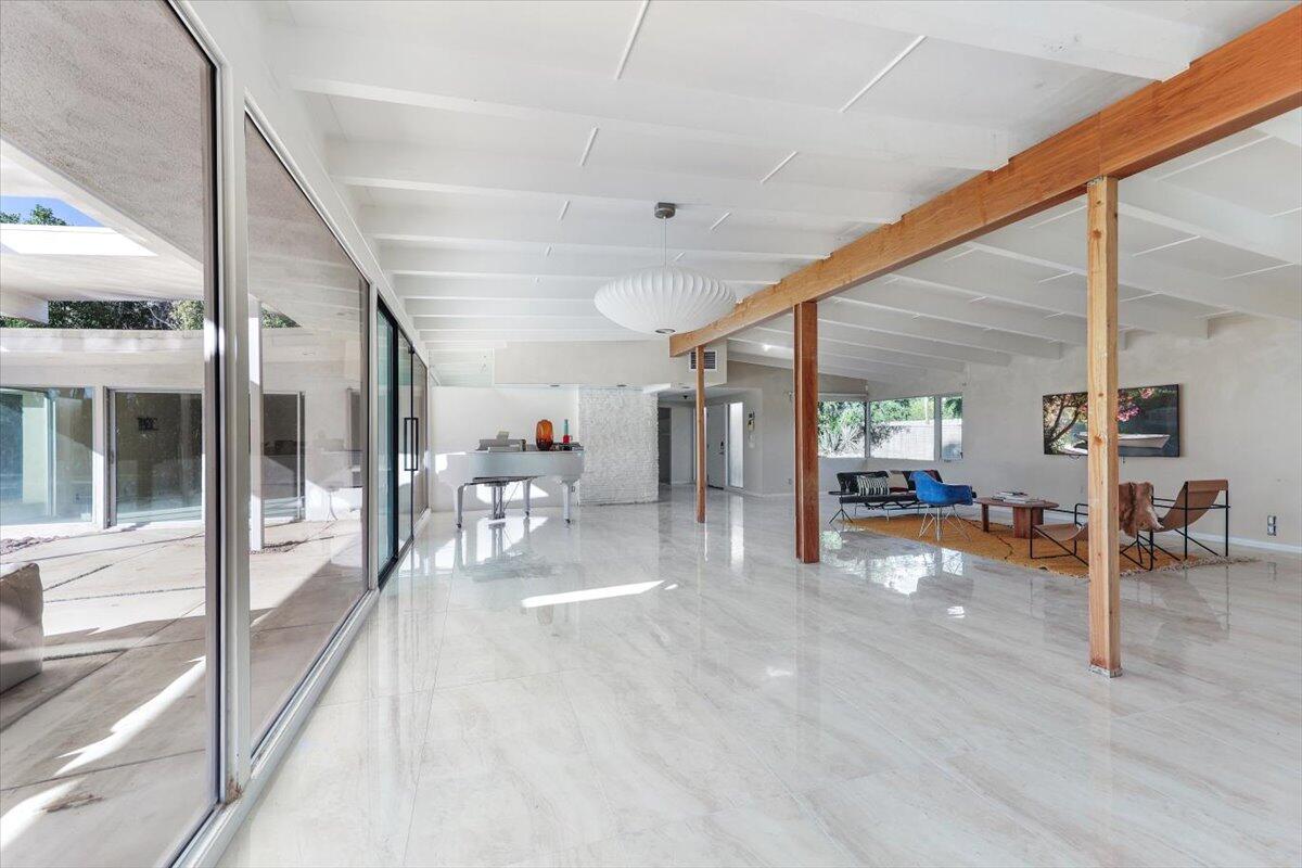 447 West Mariscal Road Palm Springs, CA 92262 - Photo 14 of 22 a view of a hall with wooden floor