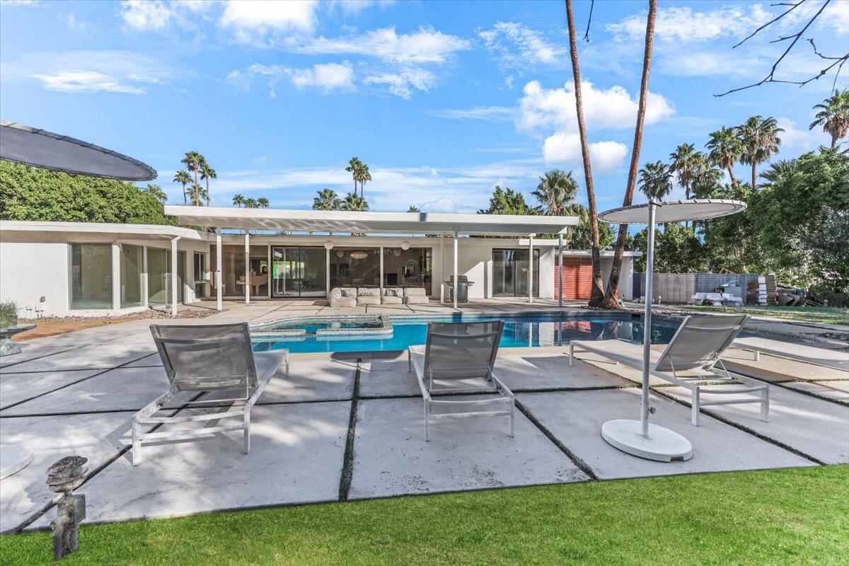 447 West Mariscal Road Palm Springs, CA 92262 - Photo 17 of 22 a view of a house with backyard porch and sitting area