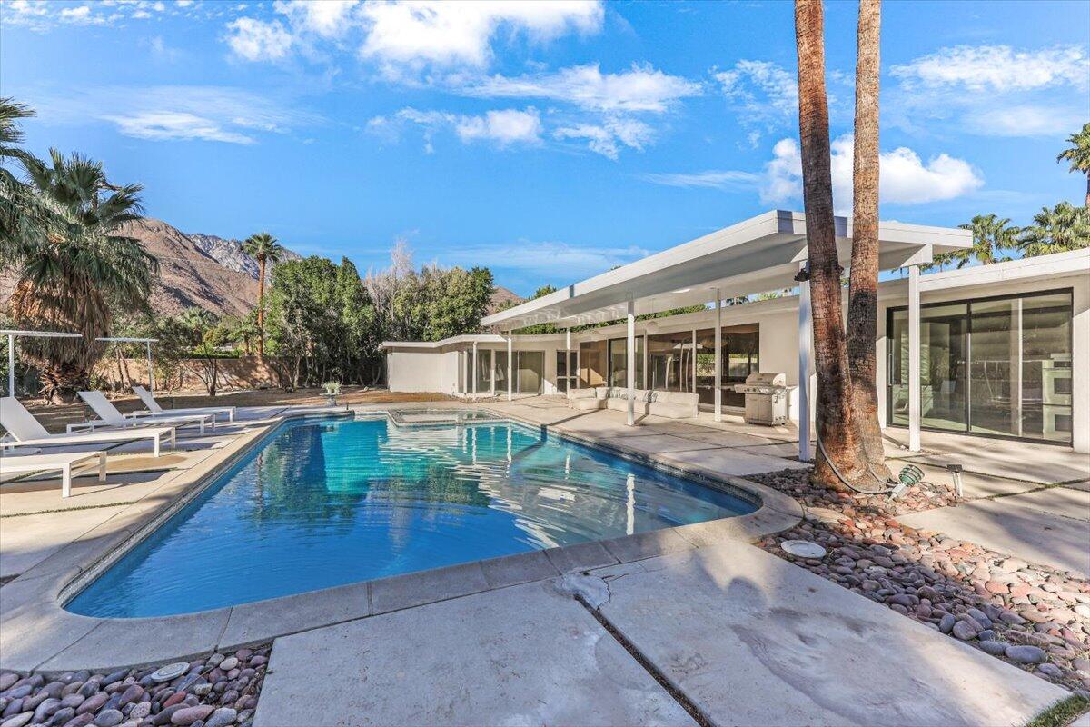 447 West Mariscal Road Palm Springs, CA 92262 - Photo 18 of 22 a front view of a house with a yard