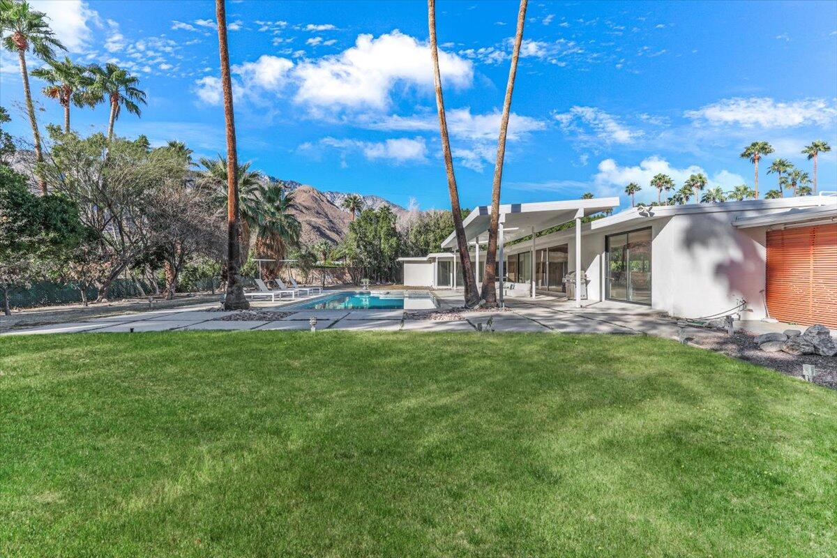 447 West Mariscal Road Palm Springs, CA 92262 - Photo 20 of 22 a house view with swimming pool and garden space