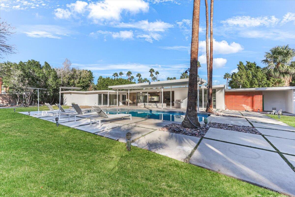 447 West Mariscal Road Palm Springs, CA 92262 - Photo 2 of 22 a view of a patio with couches chairs and a yard
