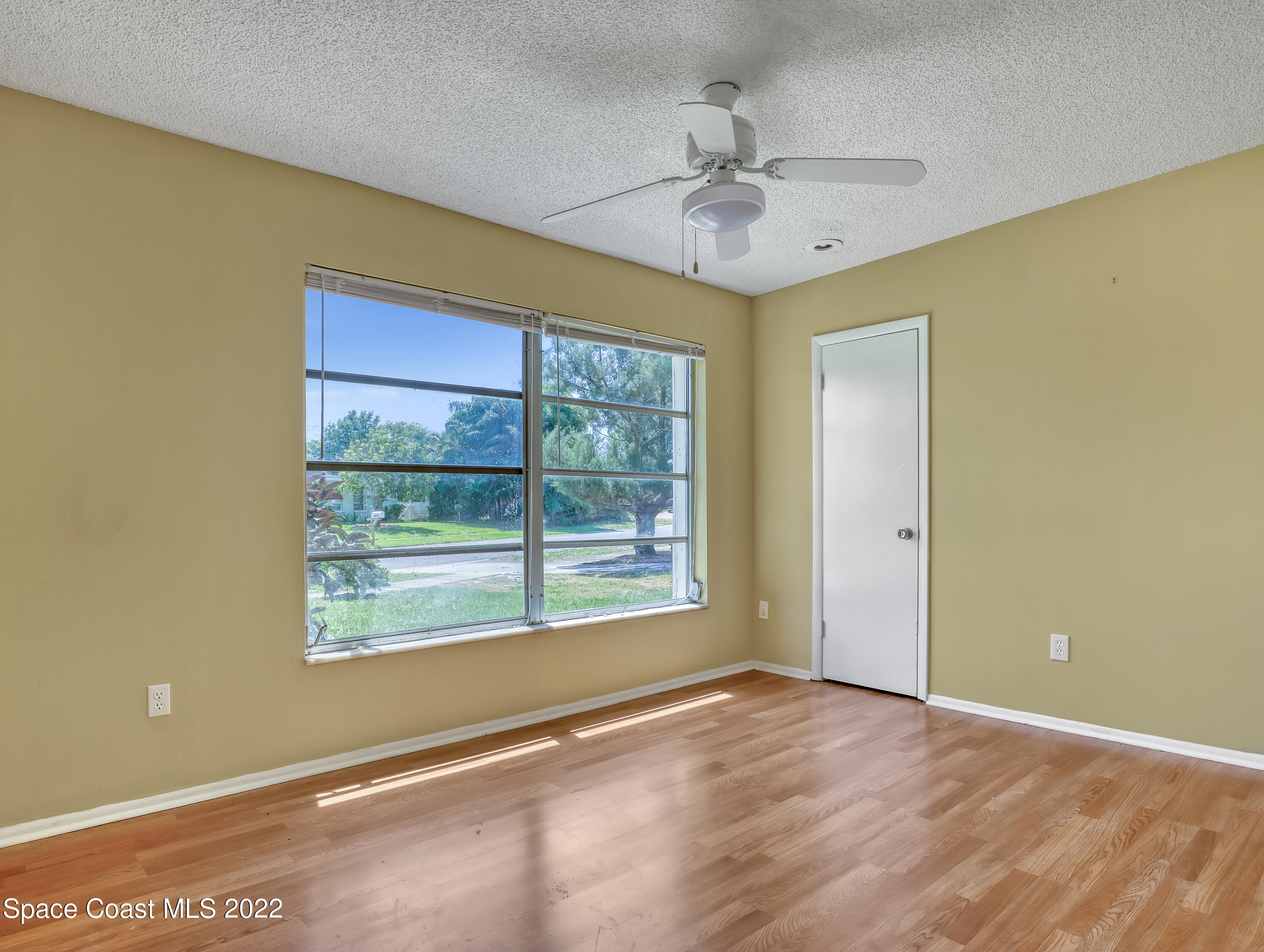 2808 Starlight Circle Northeast Palm Bay, FL 32905 - Photo 21 of 33 a view of an empty room with a window