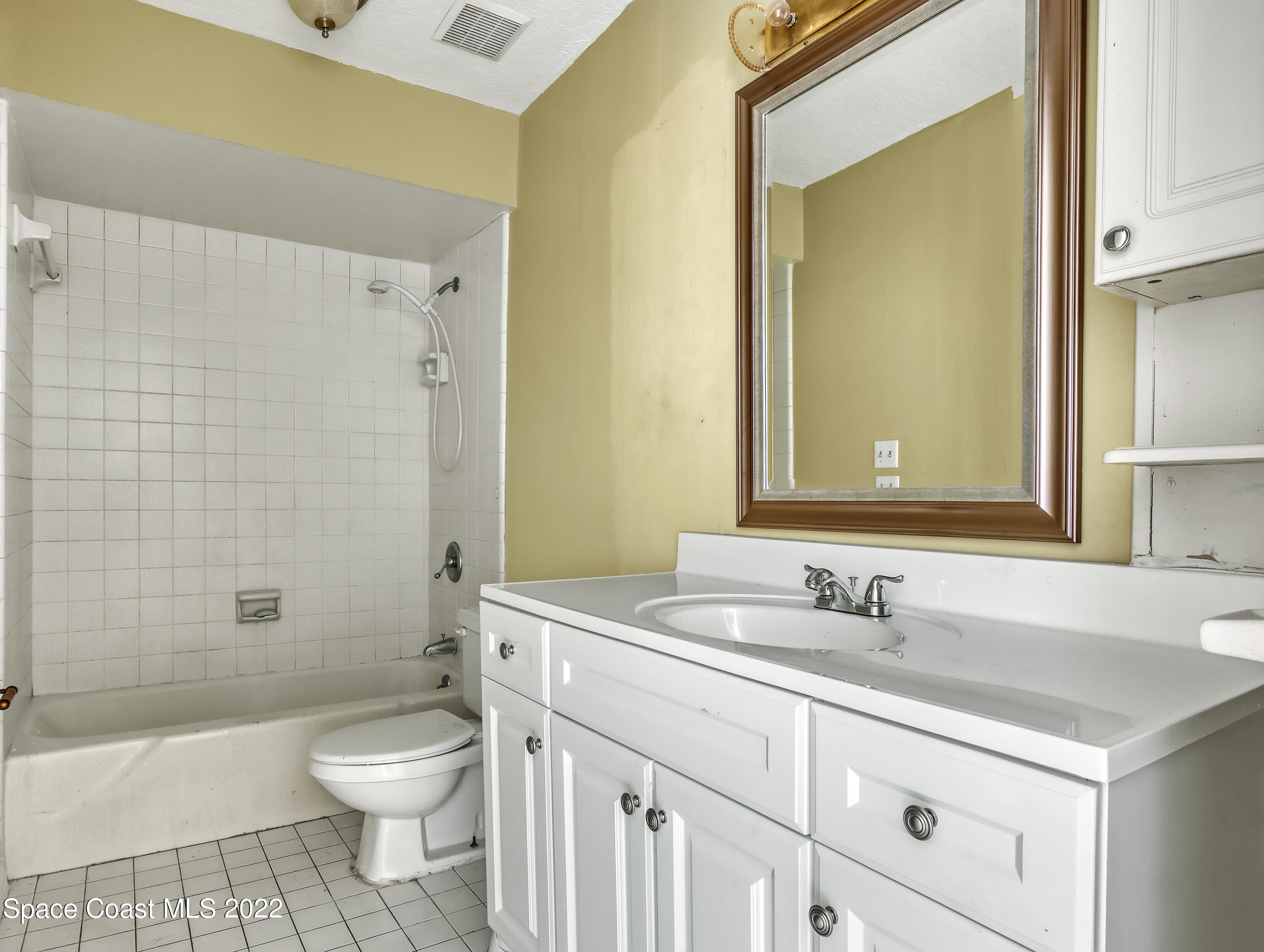 2808 Starlight Circle Northeast Palm Bay, FL 32905 - Photo 24 of 33 a bathroom with a sink a toilet and shower