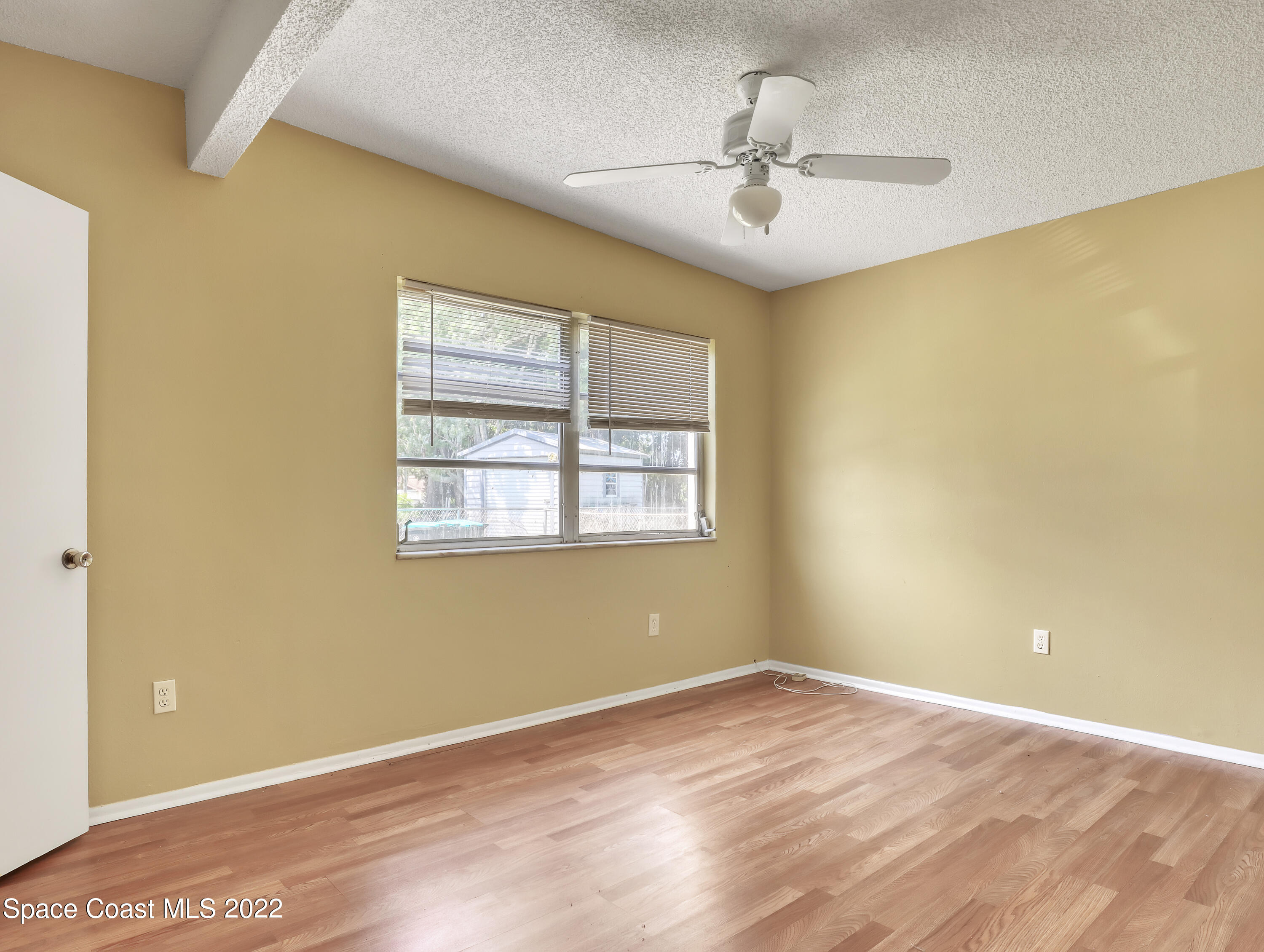 2808 Starlight Circle Northeast Palm Bay, FL 32905 - Photo 25 of 33 a view of an empty room with a window