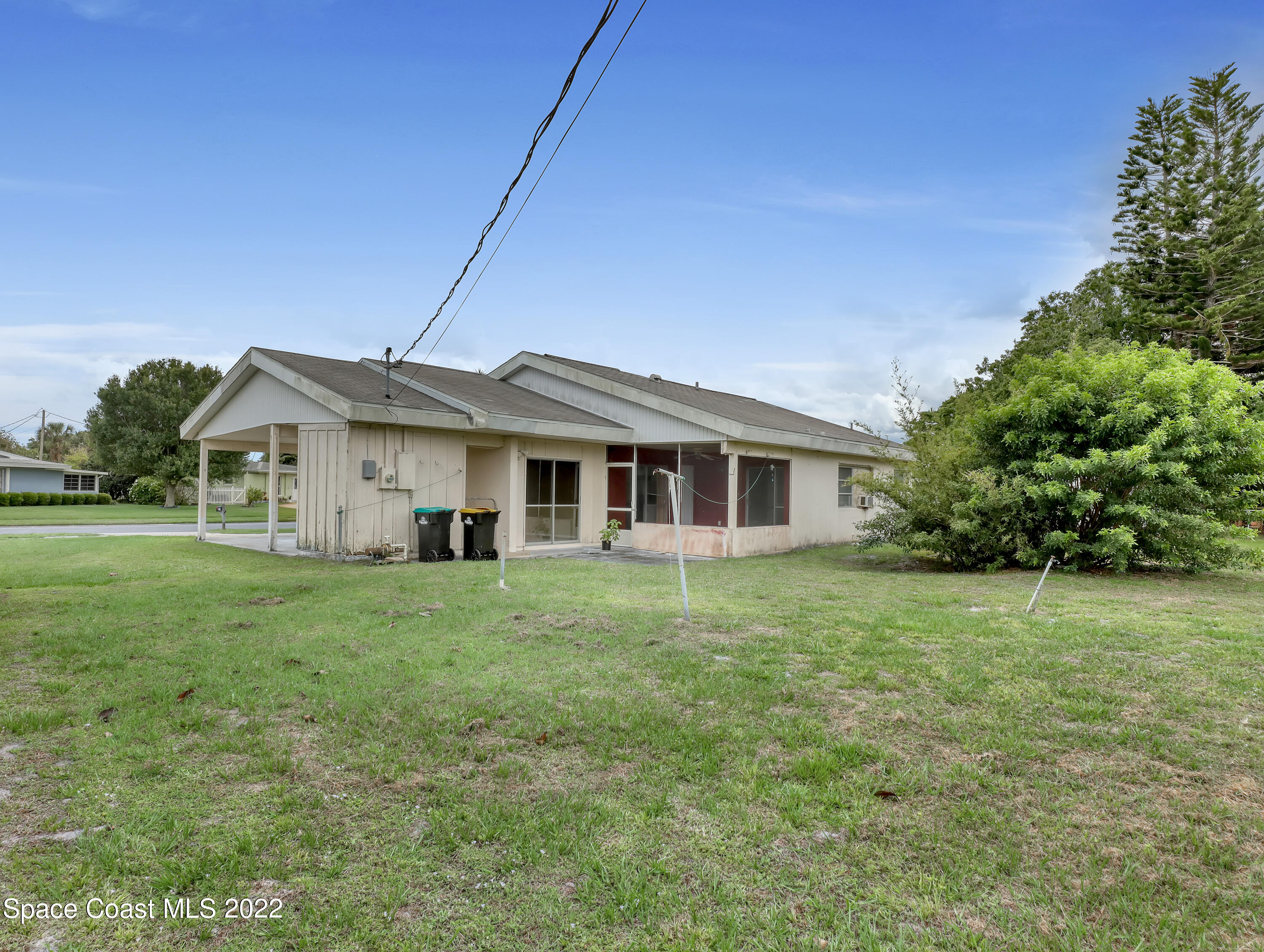 2808 Starlight Circle Northeast Palm Bay, FL 32905 - Photo 30 of 33 a front view of a house with a garden