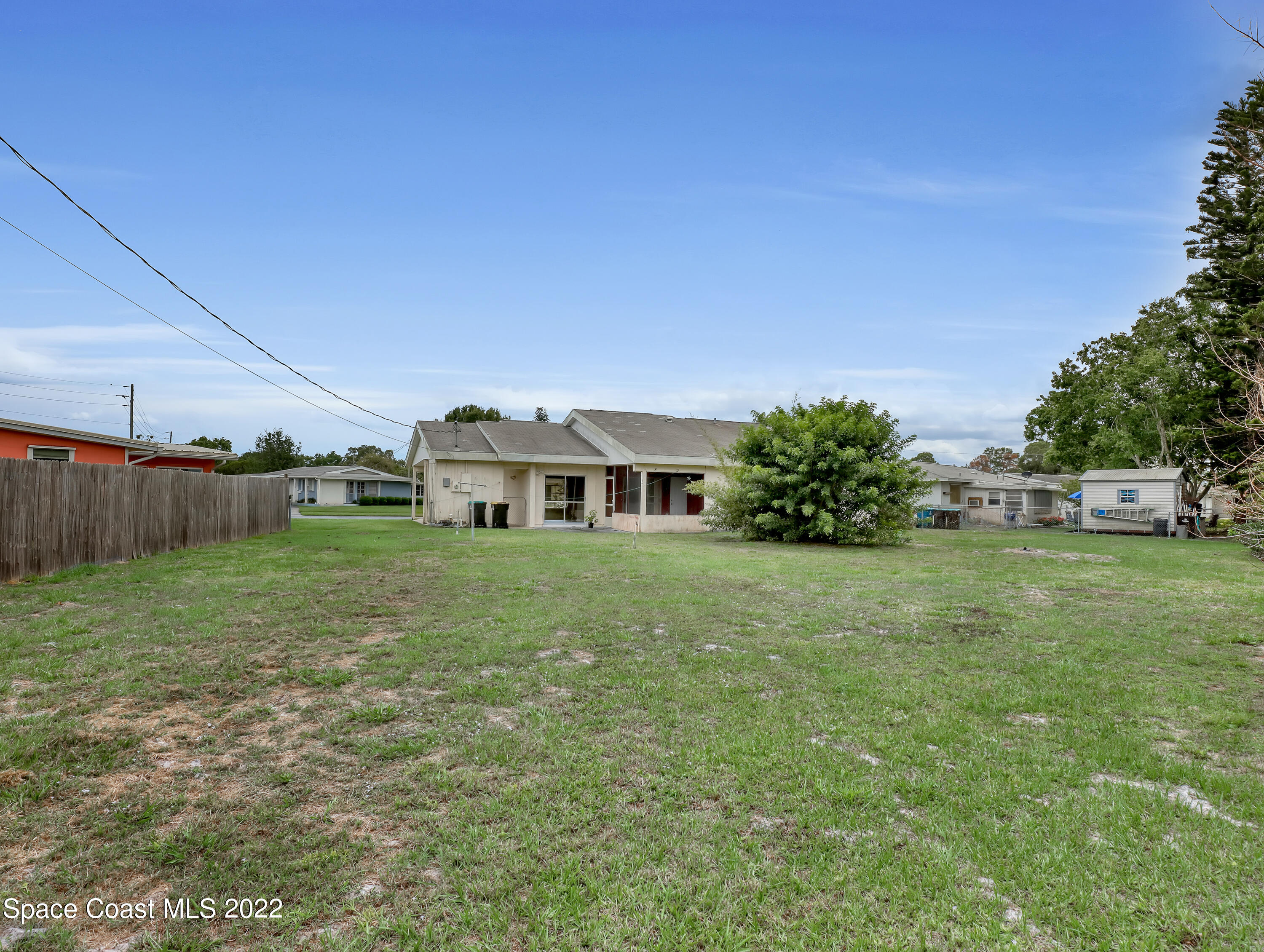 2808 Starlight Circle Northeast Palm Bay, FL 32905 - Photo 31 of 33 a front view of a house with a garden