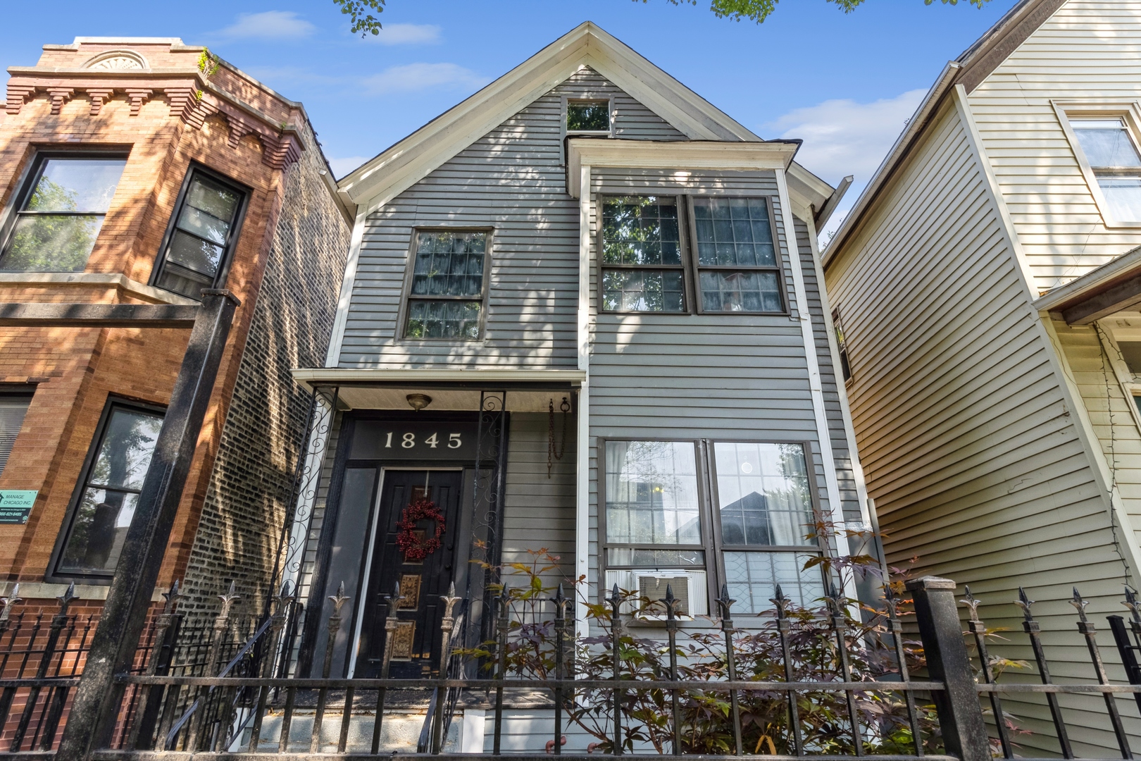 1845 North Albany Avenue, Unit 1 Chicago, IL 60647 - Photo 1 of 24 a front view of a house