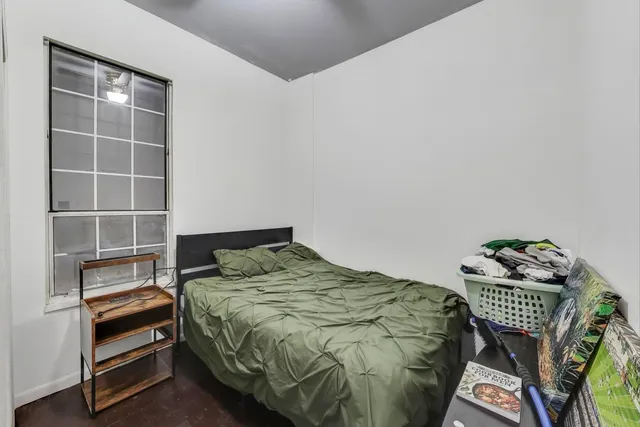 a bedroom with a bed and a closet