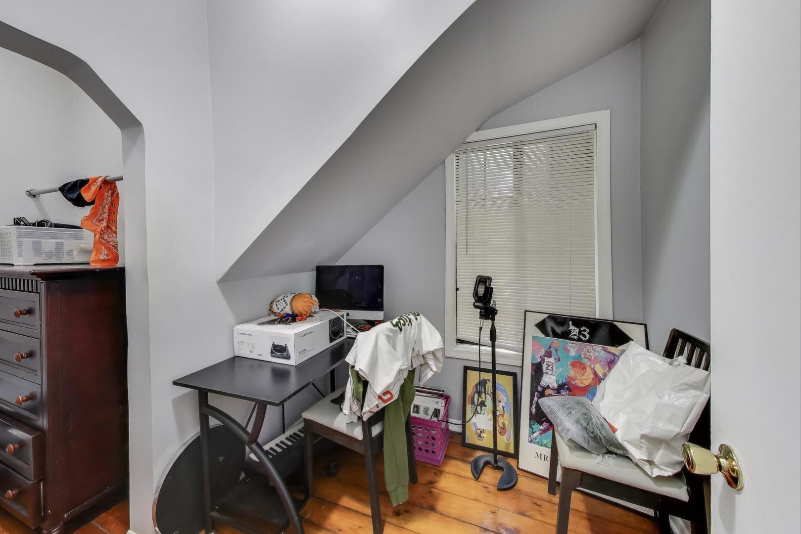 1845 North Albany Avenue, Unit 1 Chicago, IL 60647 - Photo 13 of 24 a view of a workspace with furniture and a window