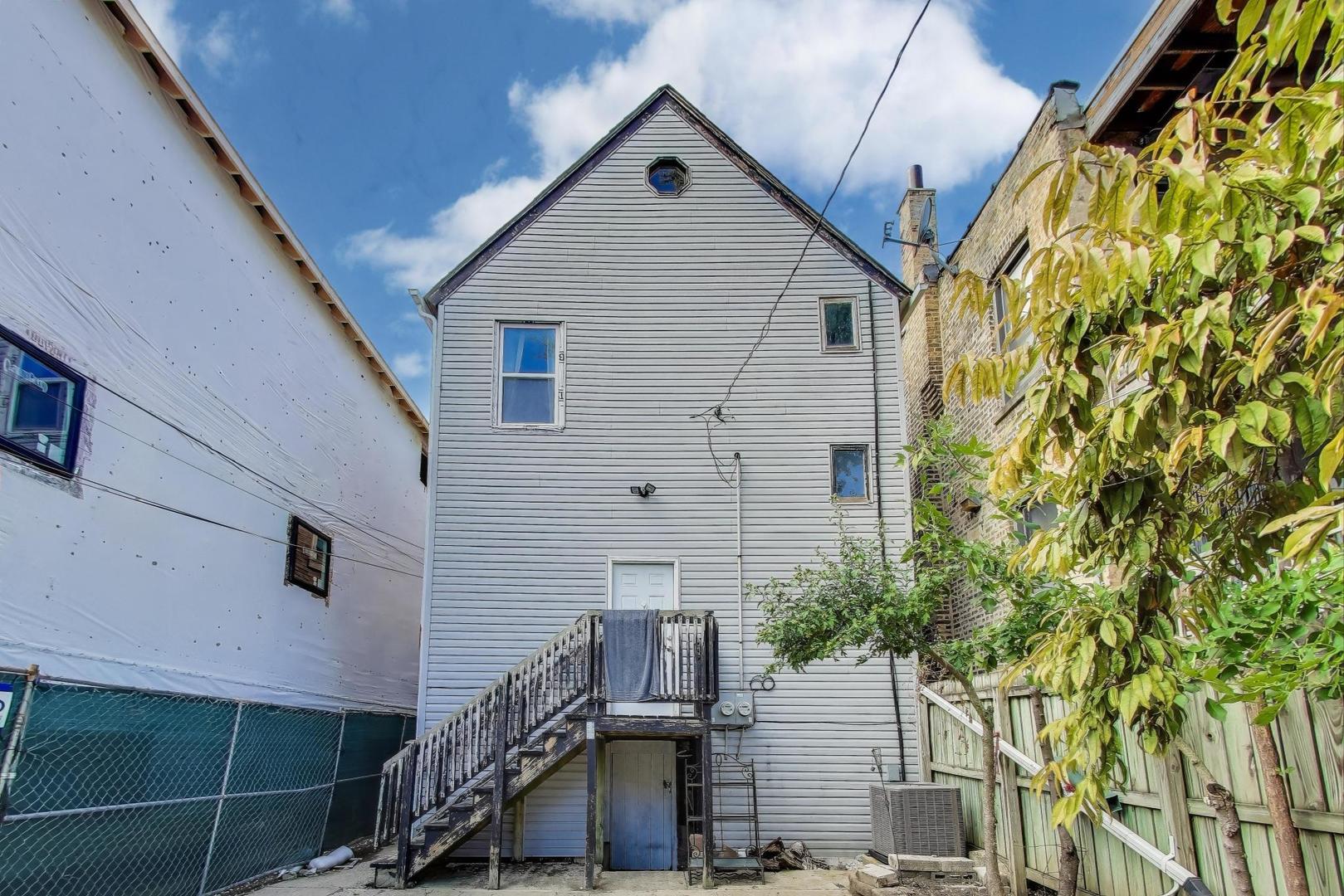 1845 North Albany Avenue, Unit 1 Chicago, IL 60647 - Photo 18 of 24 a bathroom with a sink and mirror