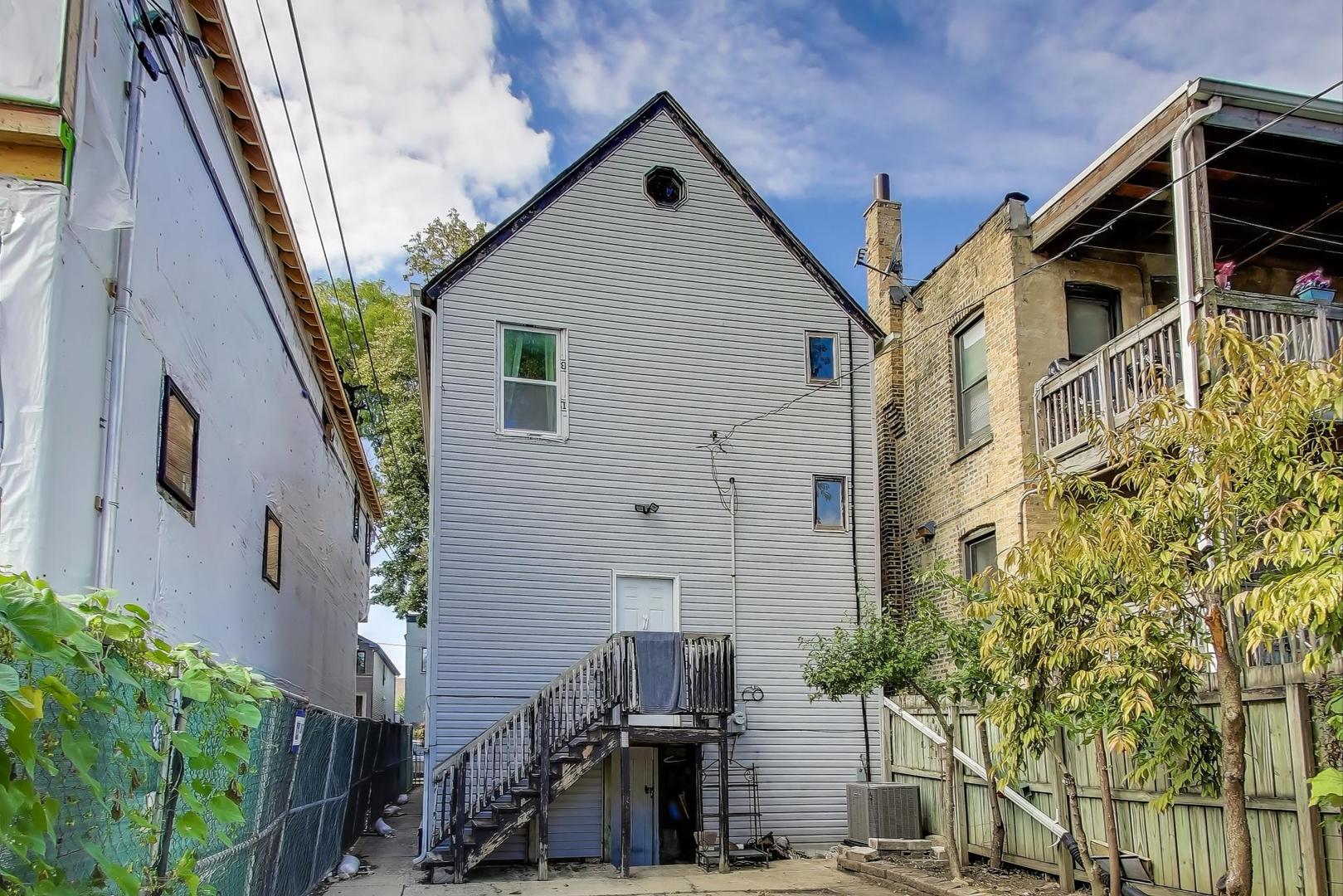 1845 North Albany Avenue, Unit 1 Chicago, IL 60647 - Photo 19 of 24 a view of a house with a yard