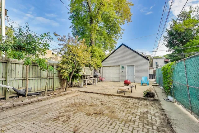 a view of a backyard with a sitting area