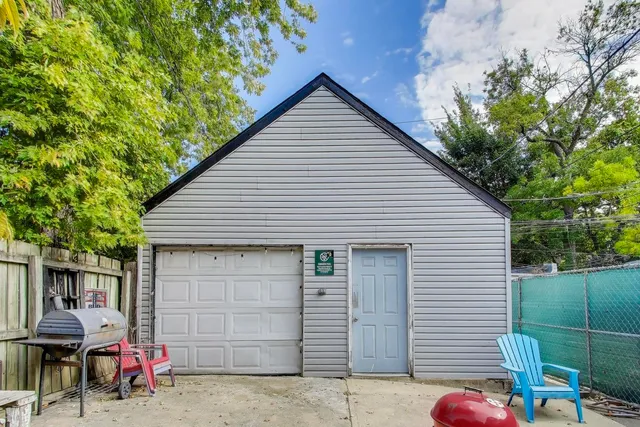 a front view of a house with outdoor seating