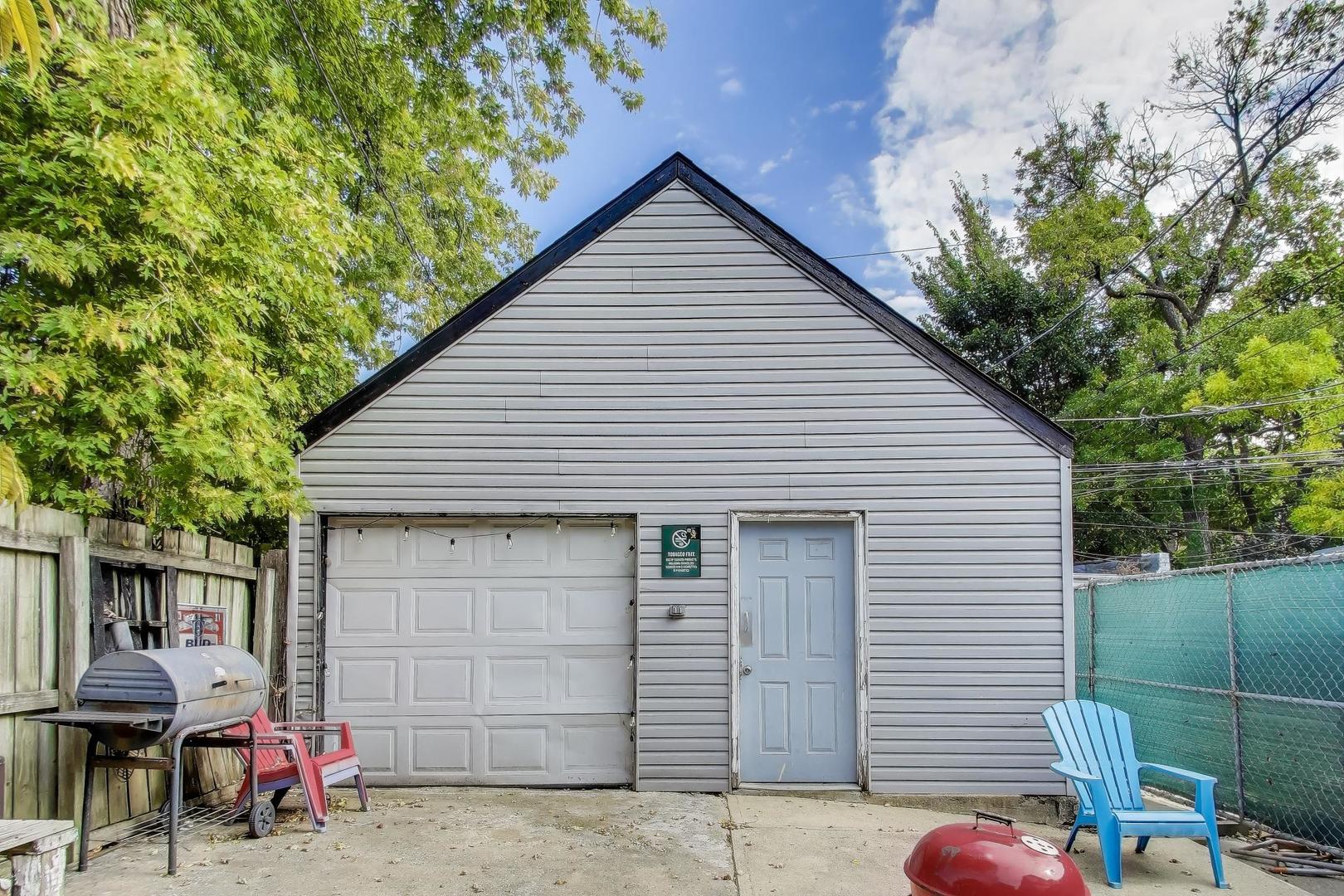 1845 North Albany Avenue, Unit 1 Chicago, IL 60647 - Photo 22 of 24 a front view of a house with outdoor seating