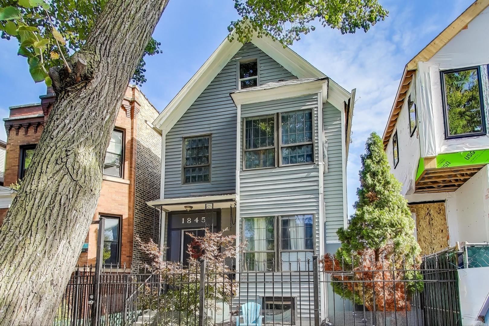 1845 North Albany Avenue, Unit 1 Chicago, IL 60647 - Photo 3 of 24 a view of a house with a yard