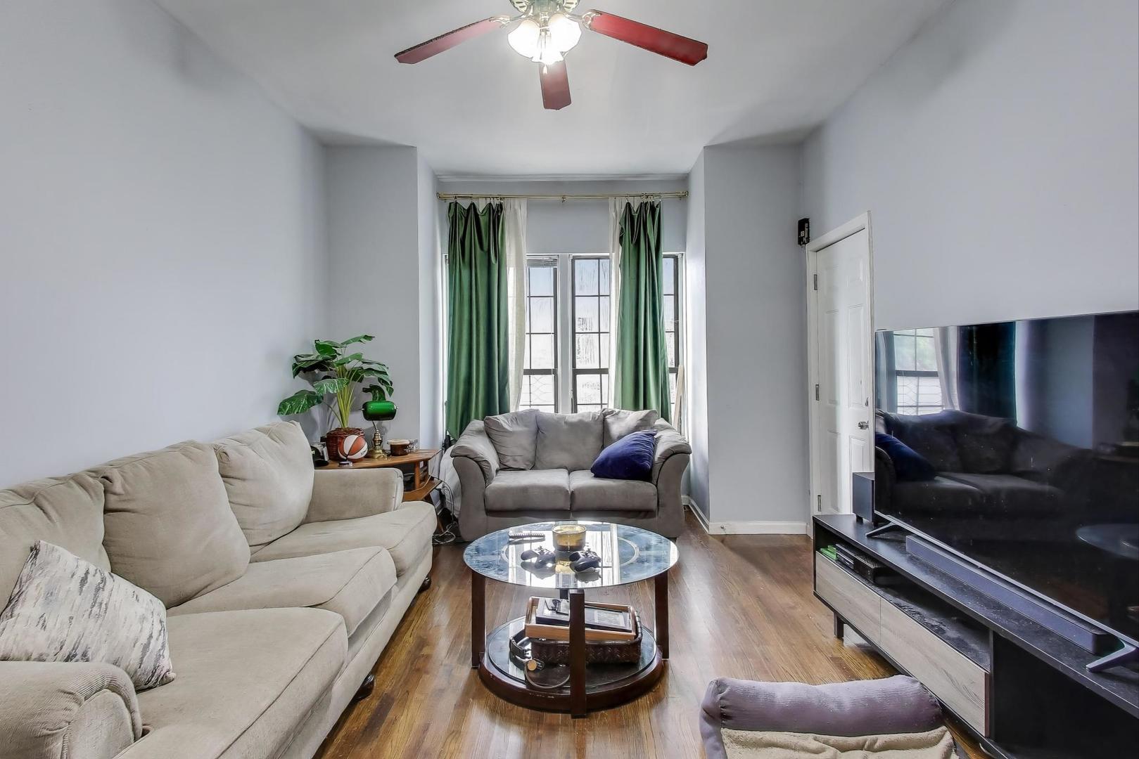 1845 North Albany Avenue, Unit 1 Chicago, IL 60647 - Photo 6 of 24 a living room with furniture and a large window
