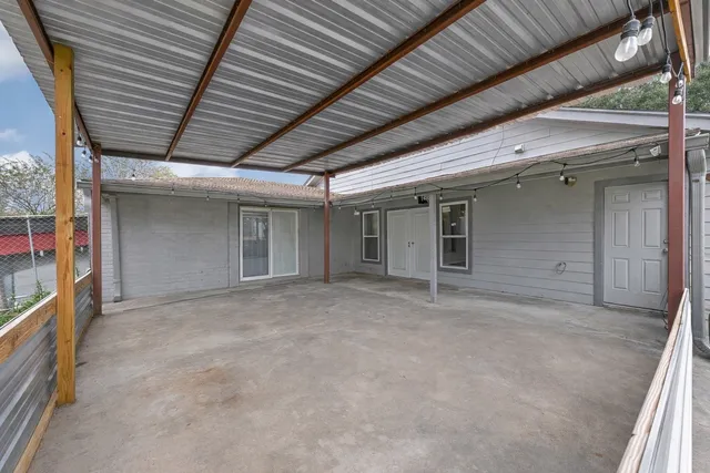 a view of swimming pool of water with outdoor seating and yard