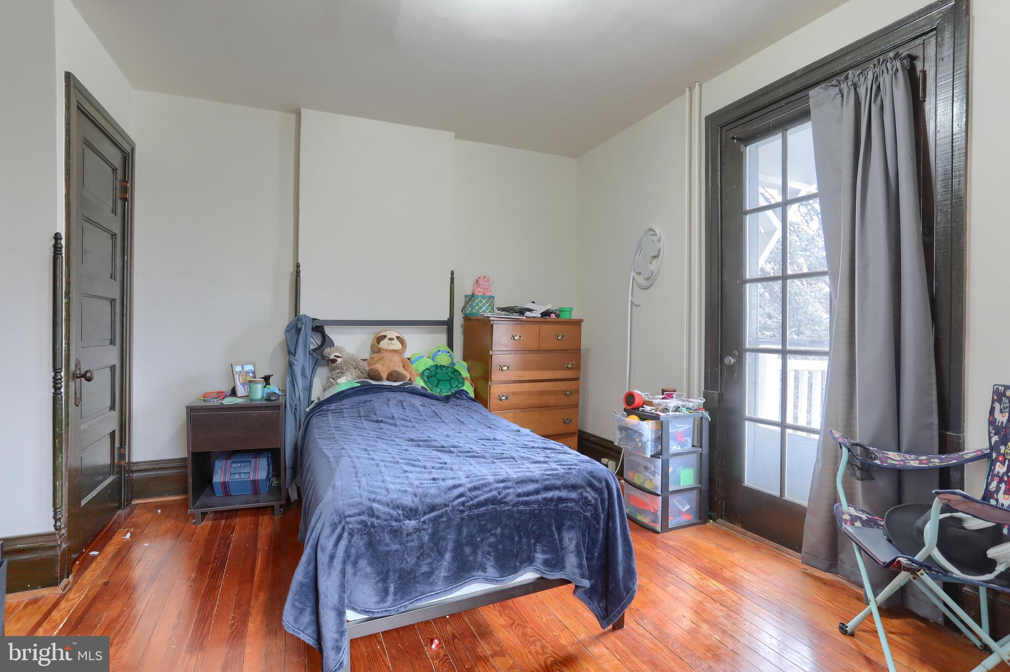 229 Cocoa Avenue Hershey, PA 17033 - Photo 14 of 28 a bedroom with a bed and wooden floor