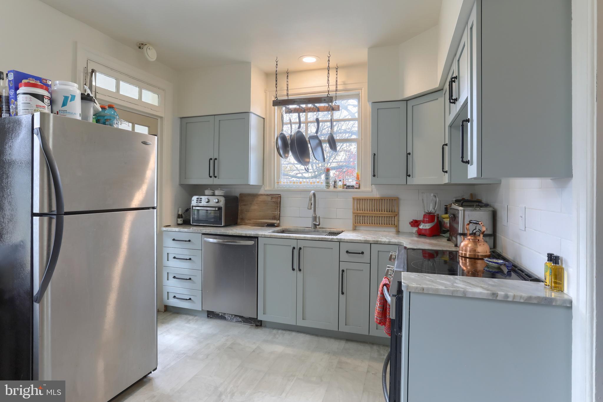229 Cocoa Avenue Hershey, PA 17033 - Photo 10 of 28 a kitchen with a refrigerator and a sink