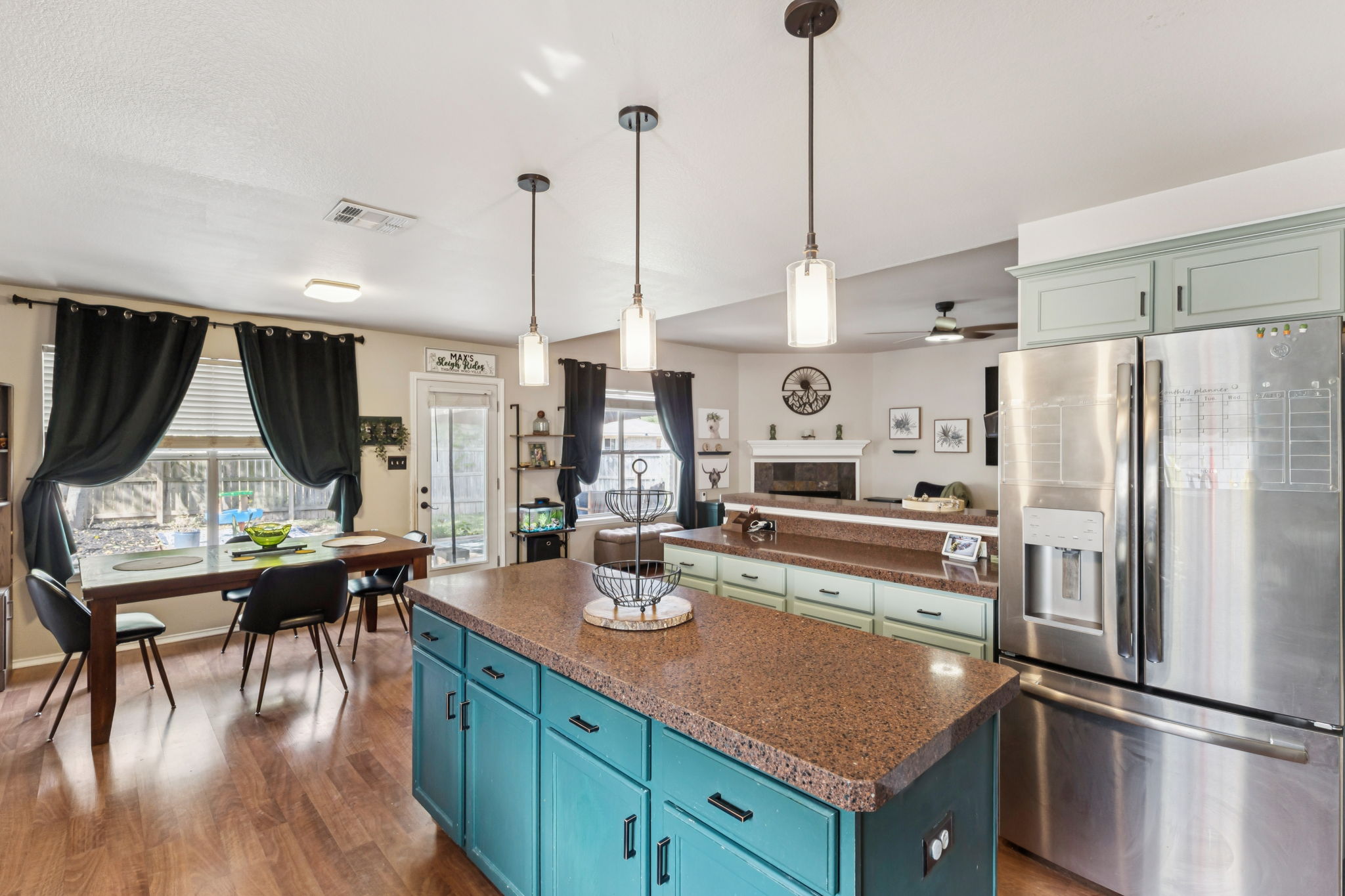 2412 Chestnut Path Round Rock, TX 78664 - Photo 6 of 26 A well-appointed kitchen island with ample counter space anchors this inviting, open-concept living area.