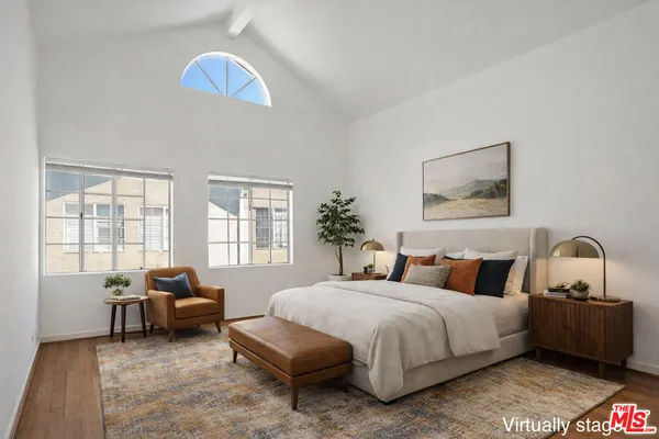a bedroom with bed and a window