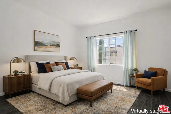 a bedroom with a bed and couch