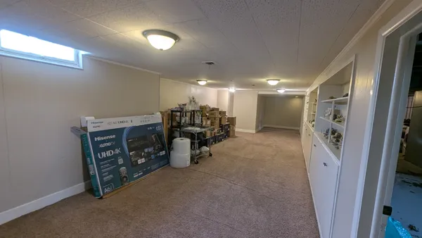 a view of a hallway with seating space