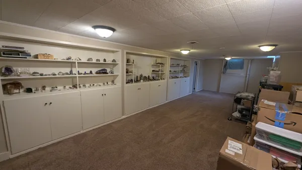 a kitchen with cabinets and window