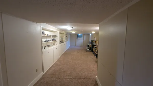 a view of a hallway with a couch