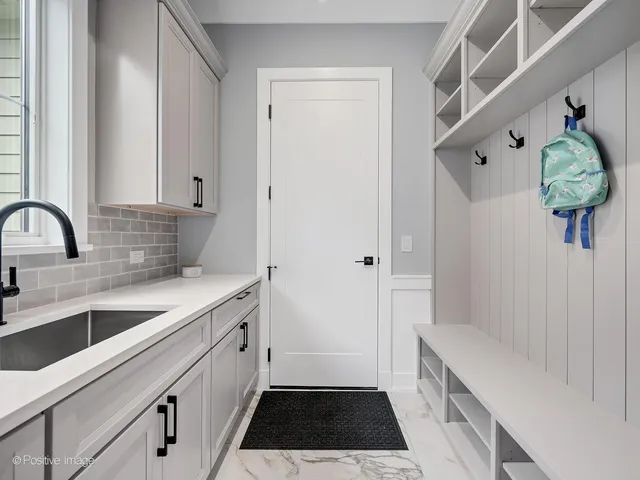 a kitchen with a sink and a refrigerator