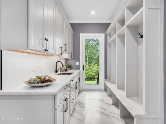 a kitchen with stainless steel appliances granite countertop a sink and a cabinets