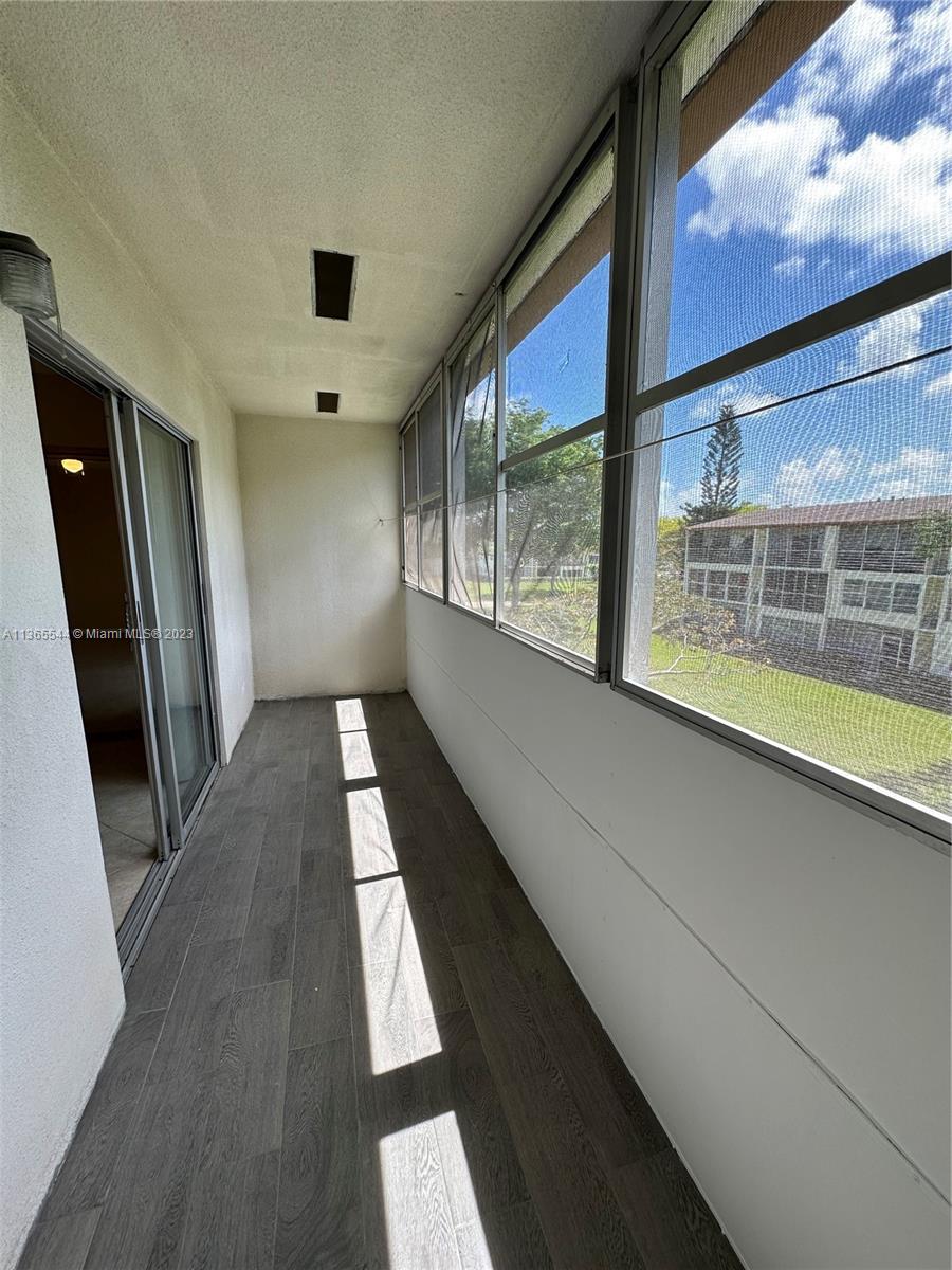538 Mansfield M, Unit 538 Boca Raton, FL 33434 - Photo 11 of 13 a view of hallway with stairs