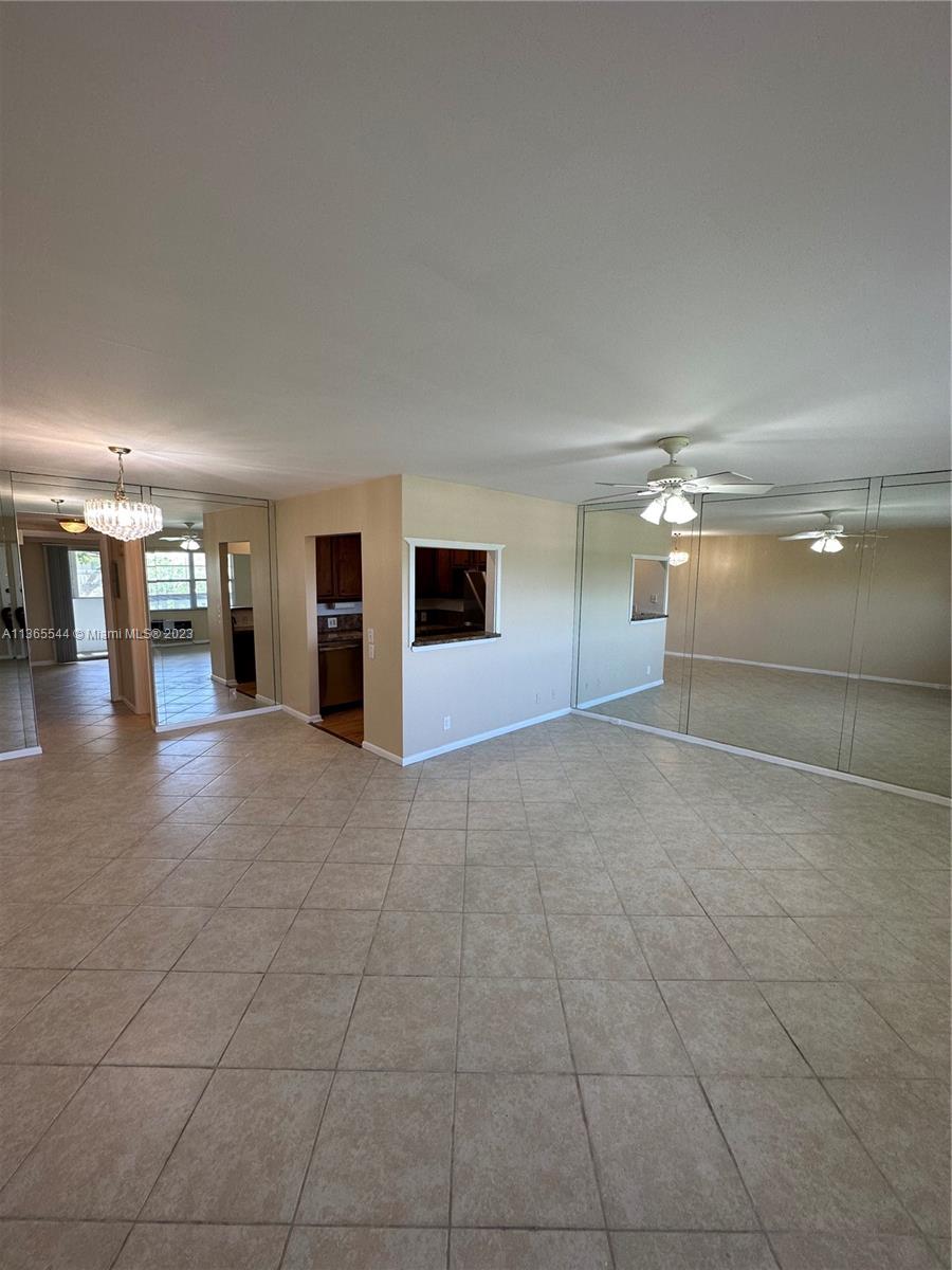 538 Mansfield M, Unit 538 Boca Raton, FL 33434 - Photo 5 of 13 a view of empty room with wooden floor